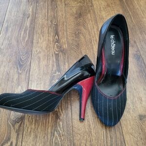 le chateau Black Pinstripe Pumps with Red Heel